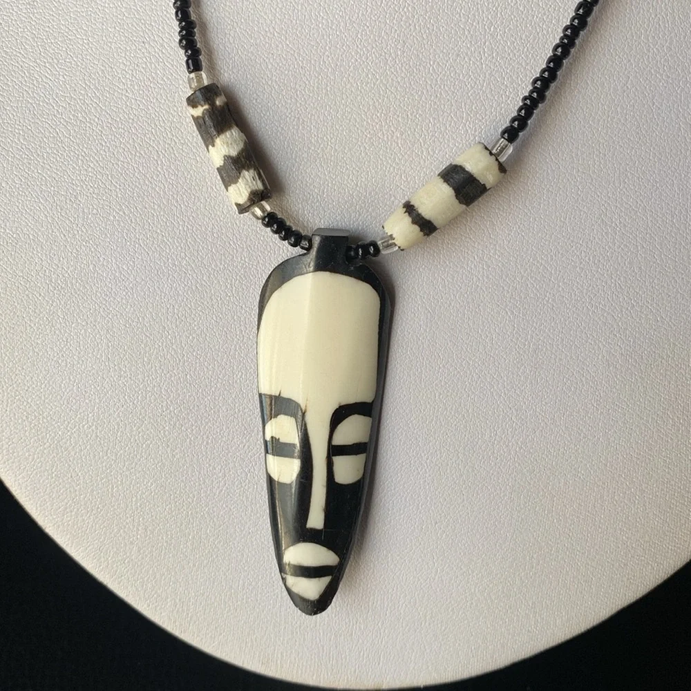 Black and Cream Beaded Necklace with Mask Pendant